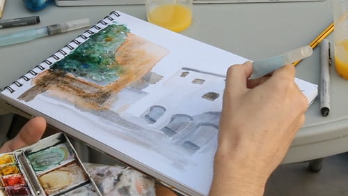 Pencil of sketcher paint in a book