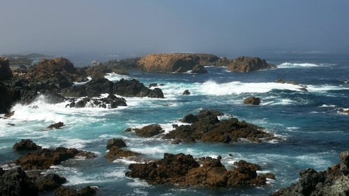 Waves Crashing on Rocky Coastline