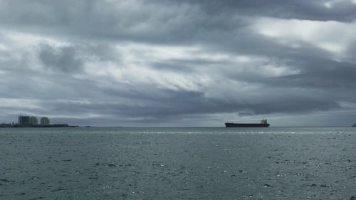 Cargo Ship Passes by the Town 925