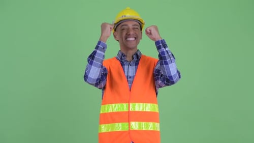 Construction Worker Celebrates Success With Fists Pumping