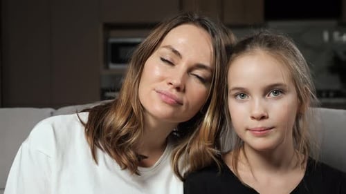 Mother and Daughter Smiling Together Indoors
