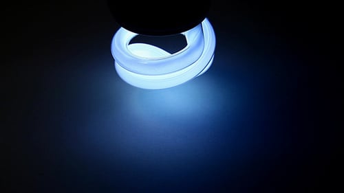 Blue Compact Fluorescent Light Bulb Shines