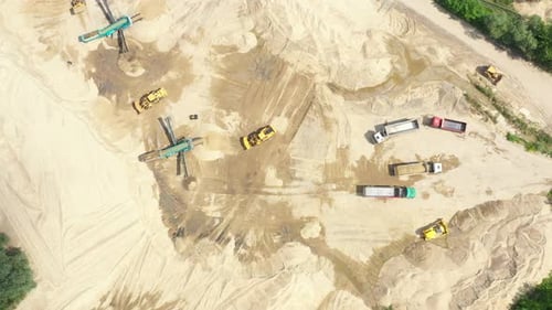 Aerial view loading bulldozer in open air quarry. Sand mining industry. Bulldozer machine. Crawler b