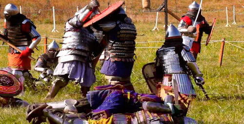 Men in Armor Engage in Medieval Battle Reenactment