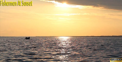 Small Boat Floating on Ocean at Golden Sunset