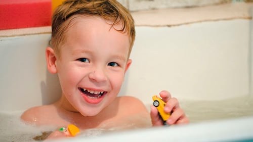 Smiling Boy Laughing in the Bubble Bath