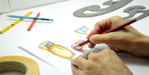 Artist Sketching Futuristic Design with Colored Pencils