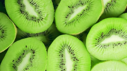Slow Motion of Rotation Ripe Green Sliced Kiwi