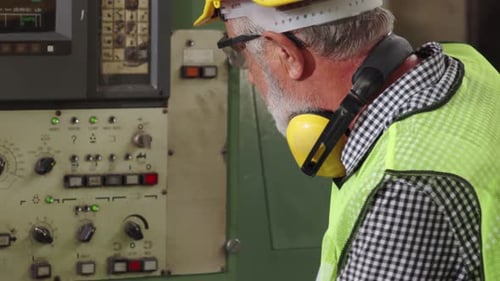 Smart Factory Worker Using Machine in Factory Workshop