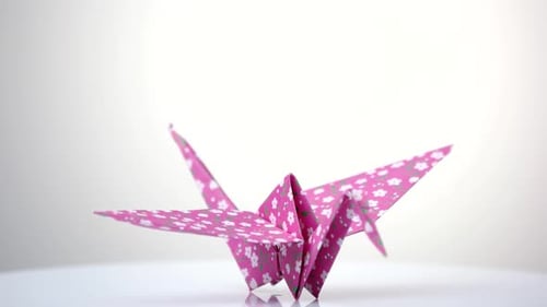 Paper Crane Origami Figure on White Background