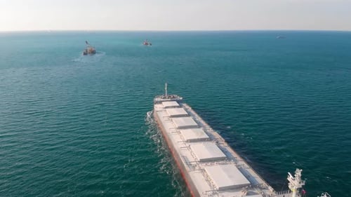 The Bulk Carrier Left the Port and Moves in the Right Direction at High Speed.