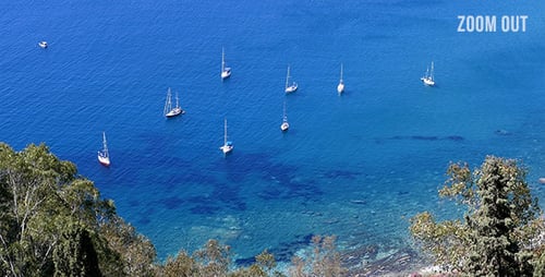 Sailboats Moored in Blue Ocean Bay Aerial View