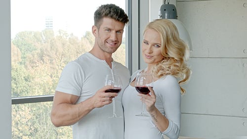 Romantic Couple Clinks Wine Glasses at Home