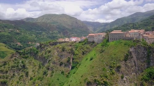 Aerial Medieval Village on Cliff Overlooking Mountain Gorge, Old Town Buildings with Red Tile Roofs