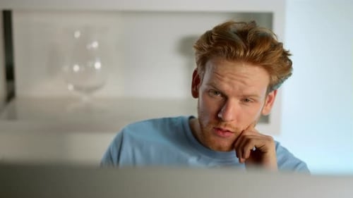Manager Contemplating Analyzing Data on Computer Screen at Remote Office Closeup
