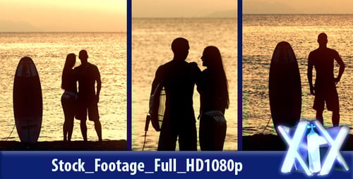 Romantic Couple With Surfboard at Sunset on Beach