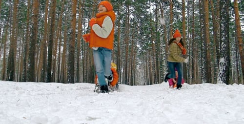 Happy Family Sledding Through Snowy Winter Forest