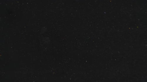 Abstract Particle Zoom on Black Background