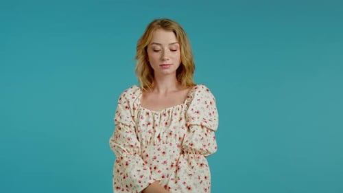 Young Woman Posing in a Floral Print Dress