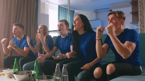 Friends Celebrate Team Victory on TV in Living Room