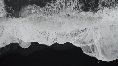 Aerial View of Black Sand Beach in Cloudy Weather. The Beginning of Spring in Iceland