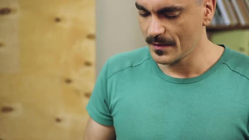 Man Using Mobile Phone Indoors