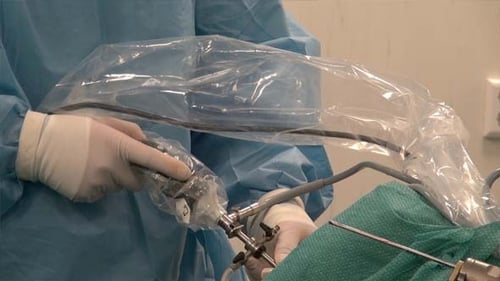 Surgeon Performing Precise Surgical Procedure in Operating Room