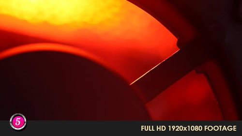 Close-Up of Glowing Red Fan Blades in Darkness