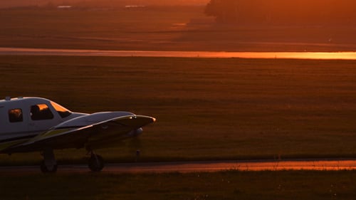 Aircraft on Runway During a Golden Sunrise
