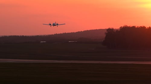 Plane Starting Against Sunset Sky