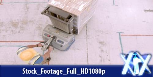 Worker Moves Pallet with Powered Lift on Job Site