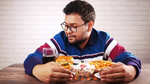 Hungry Man Waiting for Eating Beef Burger on Table Close Up