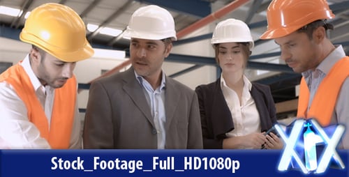 Team of Professionals Inspecting Construction Blueprints