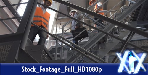 Men Walking Down the Metal Staircase