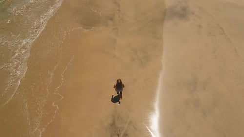 Girl Walking on the Beach