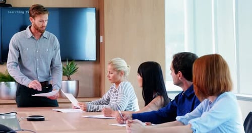 Business Team Attends Meeting in Modern Office