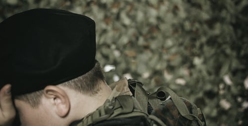 Sorrowful Soldier Lowering His Head