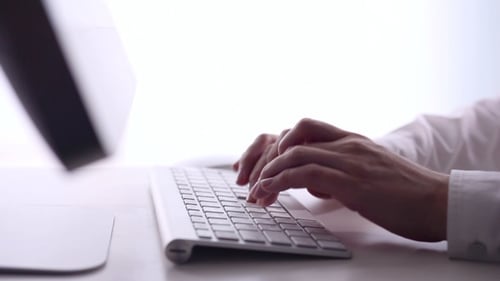 Business Woman Typing on a Computer