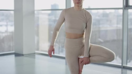 Slim Woman Practising Tree Pose