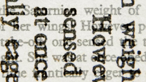 Macro Shot of Printed Text on White Paper