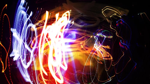 Abstract Colorful Light Streaks Against Black Background