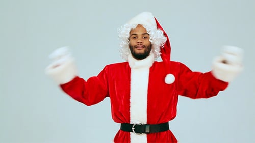 Man in Santa Costume Dancing Joyfully