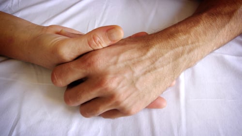 Couple Hold Hands in Intimate Close Up Shot