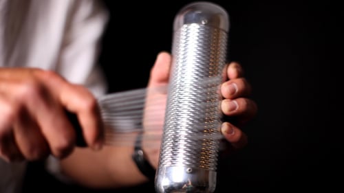 Percussionist Playing Metal Guiro