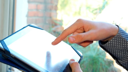 Hands Using Tablet Computer Indoors Close Up