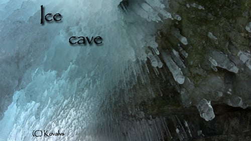Icy Cave with Long Icicles in Winter