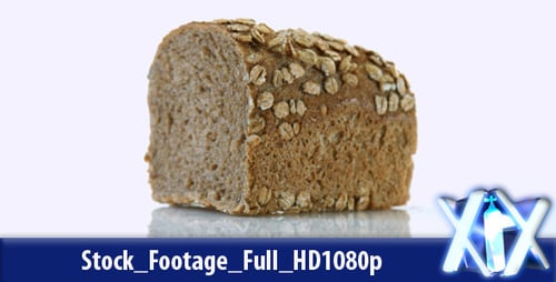Loaf of Brown Oat Bread Rotating Slowly