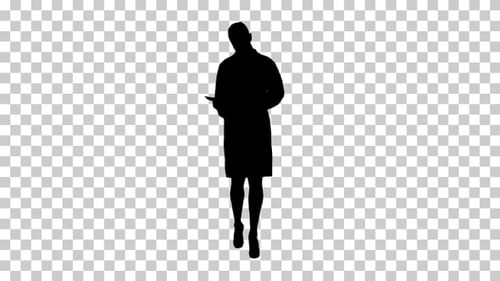 Walking Silhouette of Professional Using a Tablet