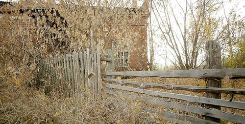 Weathered Wooden Fence in Rural Field