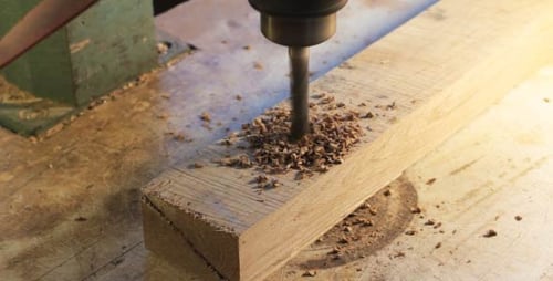 Drilling into Wood Close Up at Workbench